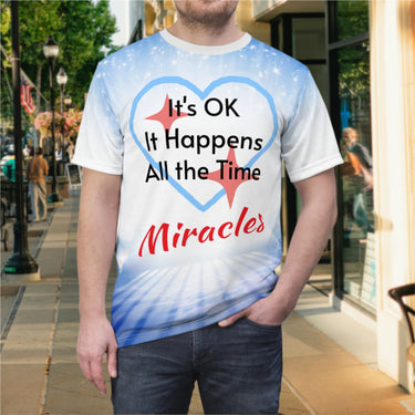 Soft, breathable activewear shirt with “Miracles Happen” design, message “It’s OK. It Happens All the Time – Miracles,” inspirational shirt for expecting God's tangible goodness daily, man wearing shirt